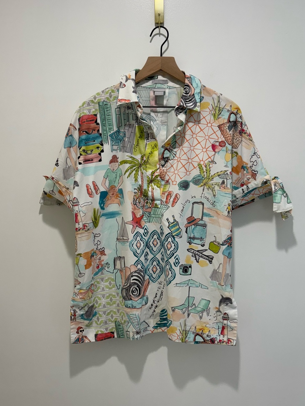 Chicos 1/4 Button Bow & Grommet Travel Top